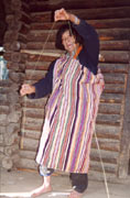 A old woman wearing a Dulong blanket